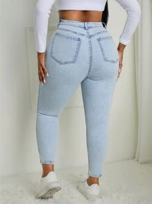 SHEIN SXY Jeans pitillo ajustados de talla grande en azul claro desgastados