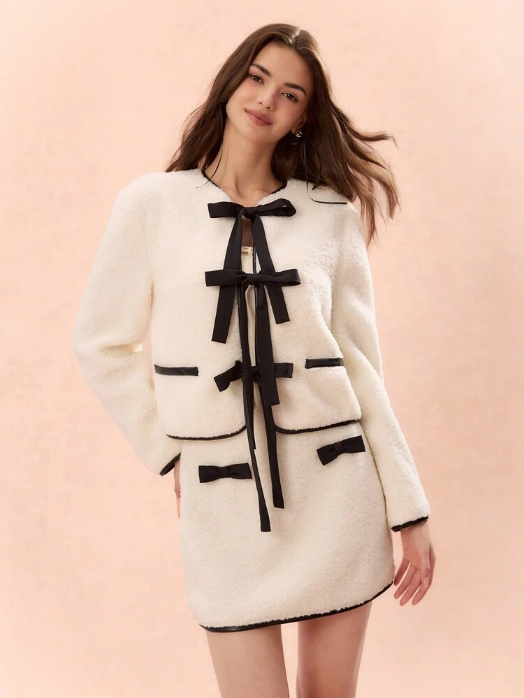 Falda elegante de mujer con ribete esponjoso de contraste, corbata de moño de contraste en blanco y negro, ropa de mujer para otoño, ropa de mujer para invierno