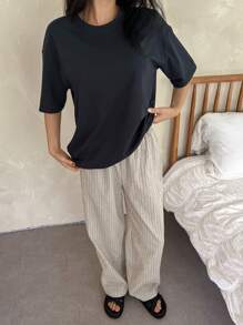DAZY Conjunto de pijama de 2 piezas con camiseta de cuello redondo de hombros caídos y pantalones acanalados de unicolor para mujer