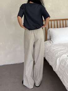 DAZY Conjunto de pijama de 2 piezas con camiseta de cuello redondo de hombros caídos y pantalones acanalados de unicolor para mujer