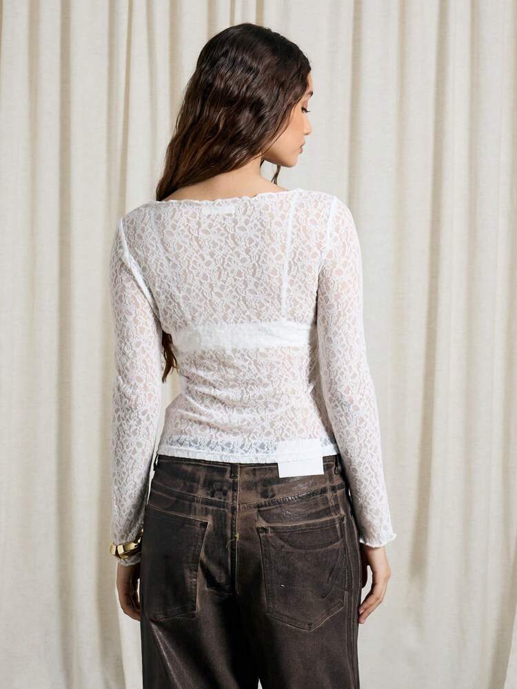 Blusa ajustada de manga larga con diseño de encaje transparente