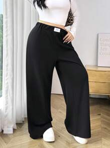 SHEIN EZwear Pantalón de chándal holgado, de textura casual y para uso diario, de talla grande - Negro - Ver 1