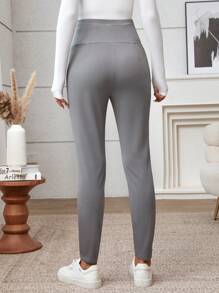 SHEIN Ciążowe legginsy plisowane w jednolitym kolorze z regulowanym stanem i swobodnym krojem