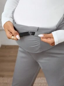 SHEIN Ciążowe legginsy plisowane w jednolitym kolorze z regulowanym stanem i swobodnym krojem