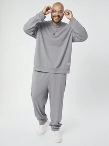 Manfinity NXTstreet Set de 2 piezas de sudadera de cuello redondo y pantalones de punto de talla grande para hombres