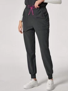 TaskEZ Conjunto informal de uniforme de scrubs con top cuello redondo minimalista y pantalón de chándal con bolsillo