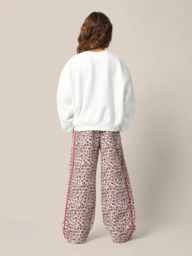 Set für Kleine Mädchen, bestehend aus Regular Fit Sweatshirt mit New York Motiv und Loose Fit Hose mit Leoparden Muster