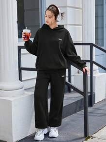 SHEIN Teen Girls Black/Solid Color/Letter Logo Hooded Sweatshirt And Pouch Pocket Sweatpants 2 Pieces Set, Casual/School/Sports Matching Set