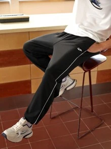 Manfinity Sport Corelite Quần Jogger Thể Thao Sọc Hai Bên Lưng Thun Co Giãn Phong Cách Bạn Trai Cho Nam Mùa Thu - màu đen - Xem 4