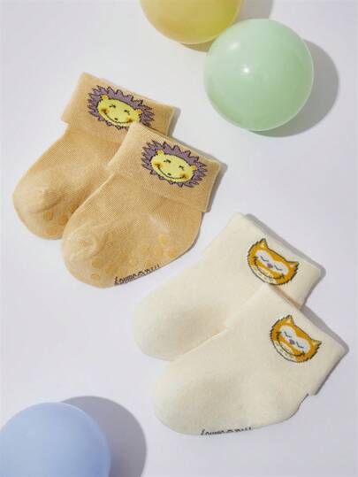 SmileyWorld® | SHEIN Set de 2 pares de calcetines blandos y absorbentes con diseños de dibujos animados lindos para bebés