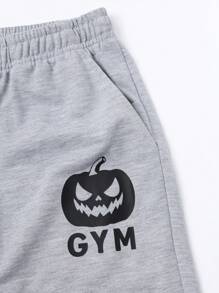 Manfinity Fitness Spodnie dresowe męskie w stylu Boyfriend Casual z nadrukiem w dynię i wiązaniem z przodu