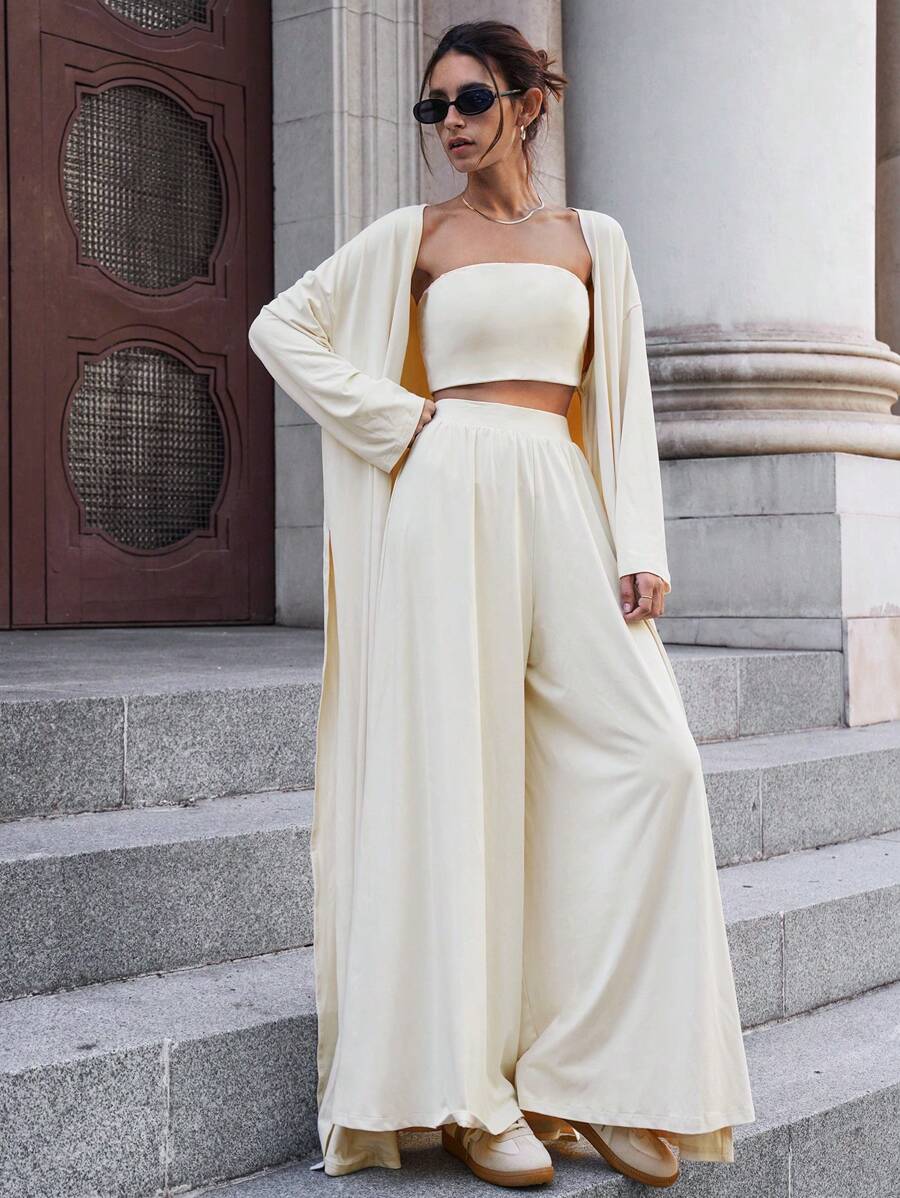 SHEIN Essnce Bộ đồ nữ thu đông 2024 Quần ống rộng thường ngày + Áo ngực đệm ống + Áo len cardigan dài tay xẻ tà dài thêm cho nữ Bộ ba món, Đồ mặc nhà rộng rãi và thường ngày, Bộ ba món dài thoải mái và thân thiện với da - Màu be - Xem 1