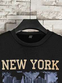 Manfinity 亲子万圣节套装：男士黑色抓绒圆领长袖卫衣，印有可爱幽灵图案，适合万圣节家庭穿着。 - 黑色 - 查看 4