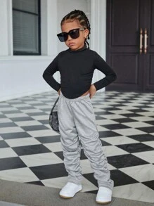 SHEIN Explorewe Girls' Casual Pleated Pants. The Pleated Design Brings A Unique 3D Effect To The Pants, Showcasing An Elegant And Fashionable Style. These Sweatpants Are Suitable For Girls To Wear In Casual Occasions, Highlighting Their Personalized And Charm. The Pleated Design Gives The Pants A Special Visual Effect, Exhibiting The Fashion Sense And Unique Elegant Of Young Girls.