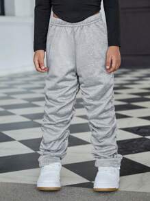 SHEIN Explorewe Girls' Casual Pleated Pants. The Pleated Design Brings A Unique 3D Effect To The Pants, Showcasing An Elegant And Fashionable Style. These Sweatpants Are Suitable For Girls To Wear In Casual Occasions, Highlighting Their Personalized And Charm. The Pleated Design Gives The Pants A Special Visual Effect, Exhibiting The Fashion Sense And Unique Elegant Of Young Girls.