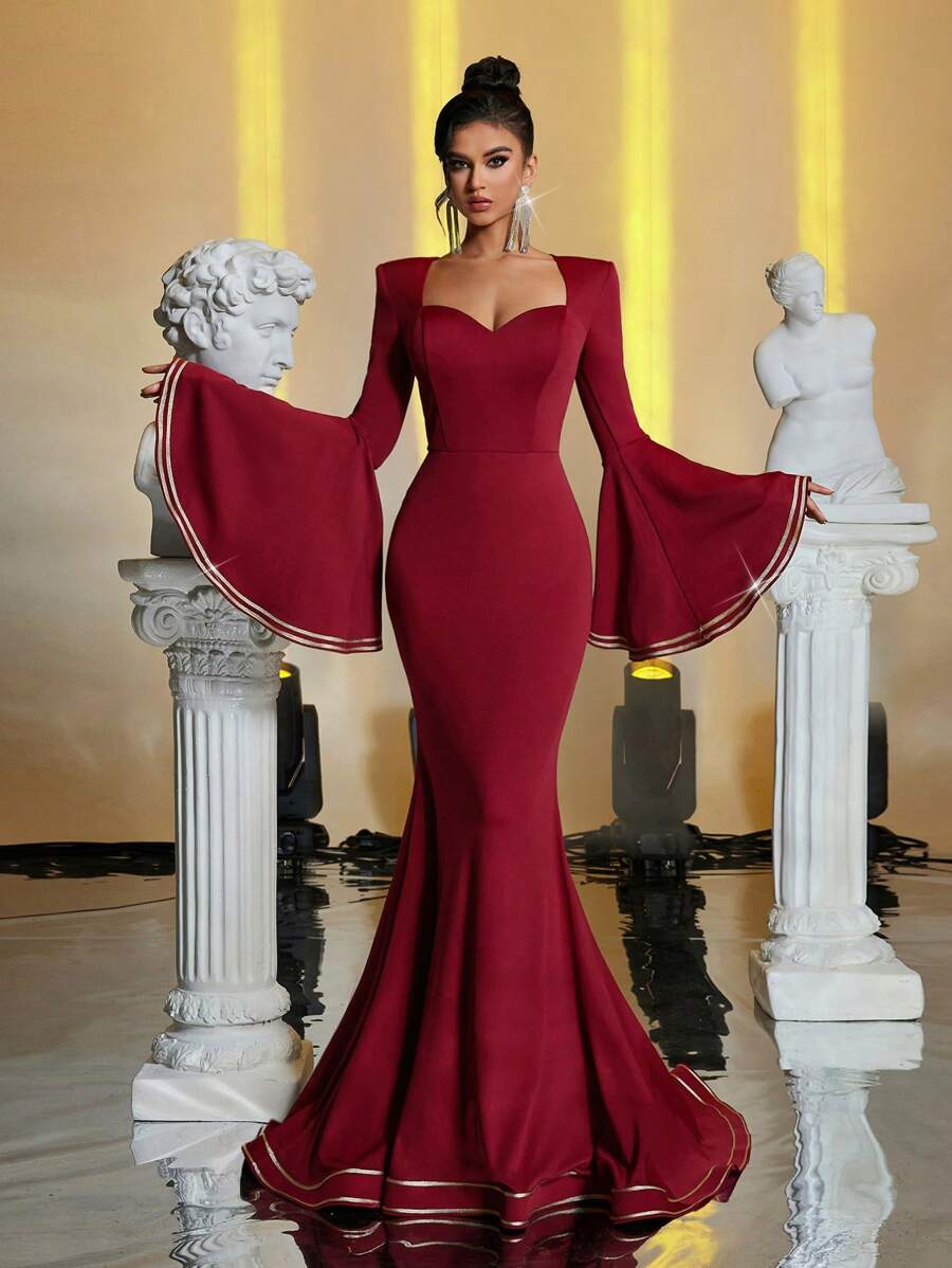 Glamrae Vestido de noche elegante de fishtail color borgoña con hombros acolchados, escote corazón, mangas de volantes dramáticas, contraste de cinta dorada lujosa, adecuado para todas las ocasiones formales, fiestas formales, bailes de graduación, invitados de bodas, graduación, cenas - Burdeos - Ver 1