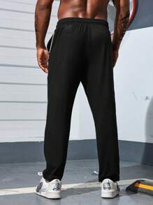 Manfinity Sport Corelite Quần thể thao nam kiểu boyfriend, màu trơn, có túi trước và dây buộc, kiểu dáng thường ngày. - màu đen - Xem 2
