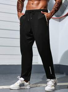 Manfinity Sport Corelite Quần thể thao nam kiểu boyfriend, màu trơn, có túi trước và dây buộc, kiểu dáng thường ngày. - màu đen - Xem 1