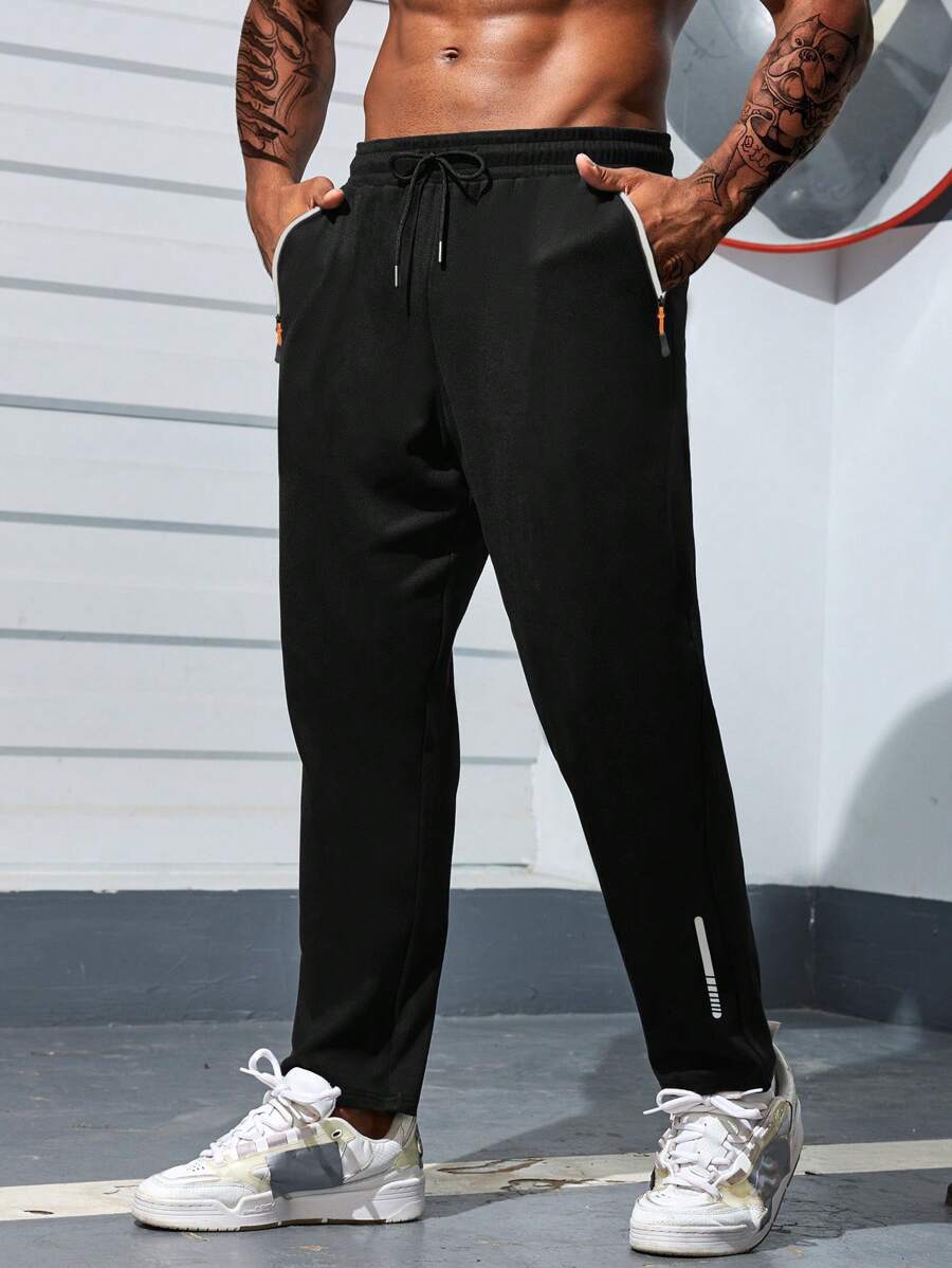 Manfinity Sport Corelite Quần thể thao nam kiểu boyfriend, màu trơn, có túi trước và dây buộc, kiểu dáng thường ngày. - màu đen - Xem 1