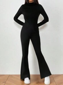 Flirla Mono negro de cuello alto con abertura, ceñido y con vuelo