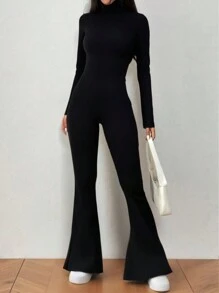 Flirla Mono negro de cuello alto con abertura, ceñido y con vuelo