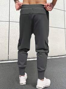 Manfinity Homme Quần nỉ nam cạp chun có túi bên hông rộng rãi có dây rút - Màu xám đen - Xem 2