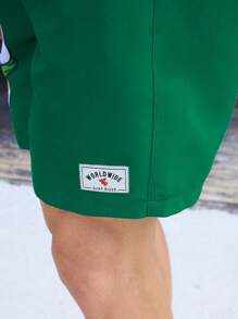 Manfinity Swimmode Pantaloncini casual da uomo con stampa di cartoni animati e lacci frontali