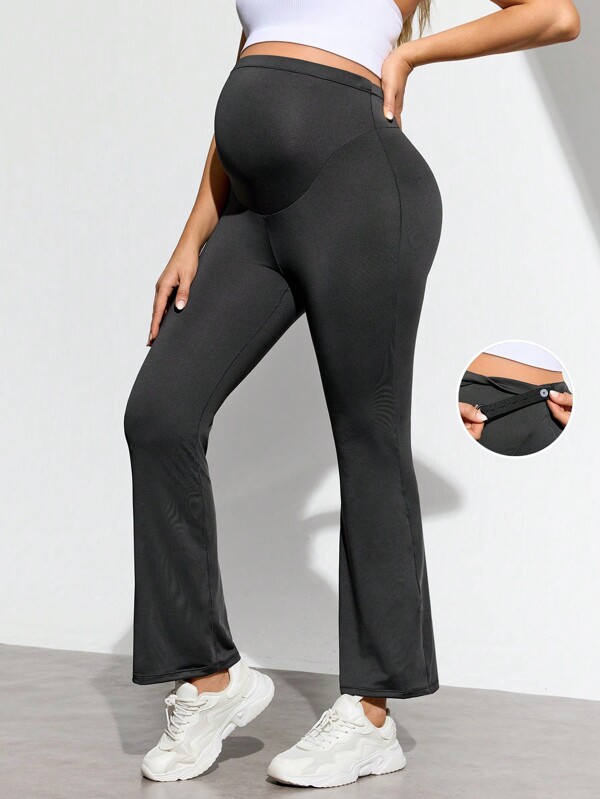 SHEIN Pantalón de chándal de maternidad con pierna acampanada y cintura ajustable de unicolor