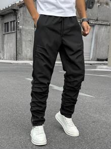 Manfinity Homme Herren einfarbige Hose mit Vordertasche und Kordel, minimalistisch, für den Alltag, schlichte lange Cargohose mit Kordelzug in Schwarz, tailliert, für Ehemann, Freund als Geschenk