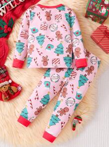 2 件装女婴舒适睡衣套装，洋红色底色上印有圣诞主题图案，长裤和长袖上衣