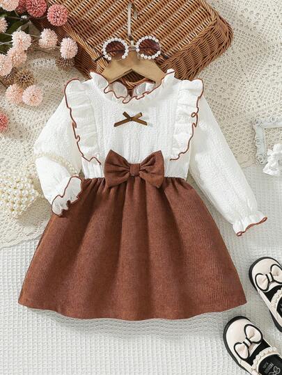 SHEIN Vintaside Kids Vestido de manga larga con volantes en el bajo, decorado con moño de pana en contraste, para niña pequeña en otoño
