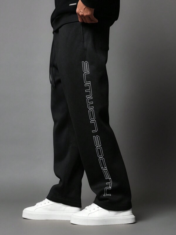 SUMWON Pantalones deportivos tipo jogger de felpa streetwear con estampado de logotipo lateral, prendas informales y modernas para deporte y relax, con ajuste relajado para entrenamiento y actividad física