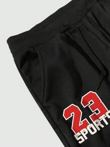 Manfinity EMRG Pantalón de chándal informal para hombre de talla grande con estampado de letras, empalmado y cordones en la parte delantera