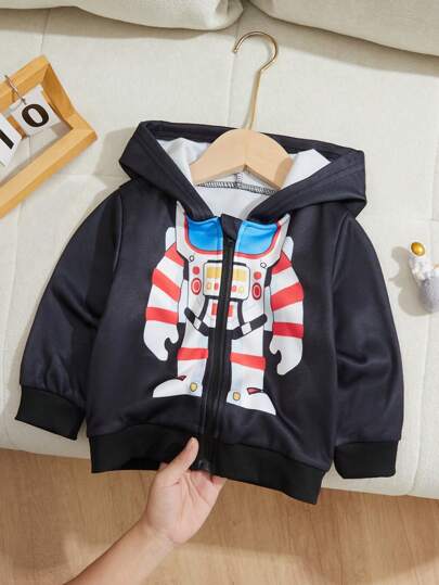 SHEIN La chaqueta con capucha con estampado de posicionamiento de astronauta para bebés niños combina el diseño clásico con capucha y el estampado infantil de astronauta, especialmente diseñada para bebés que les gusta explorar. Ya sea para salidas al aire libre o para uso diario, puede brindar a su bebé una experiencia dual de moda y comodidad.