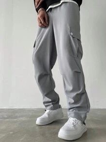 Manfinity Homme Pantalones anchos de talla grande con bolsillo con solapa, cintura con cordón y unicolor, estilo urbano para hombre