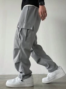 Manfinity Homme Pantalones anchos de talla grande con bolsillo con solapa, cintura con cordón y unicolor, estilo urbano para hombre