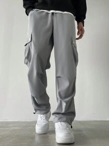 Manfinity Homme Pantalones anchos de talla grande con bolsillo con solapa, cintura con cordón y unicolor, estilo urbano para hombre