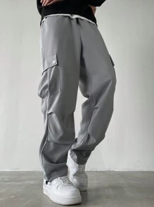Manfinity Homme Pantalones anchos de talla grande con bolsillo con solapa, cintura con cordón y unicolor, estilo urbano para hombre