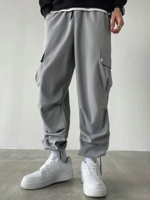 Manfinity Homme Pantalones anchos de talla grande con bolsillo con solapa, cintura con cordón y unicolor, estilo urbano para hombre