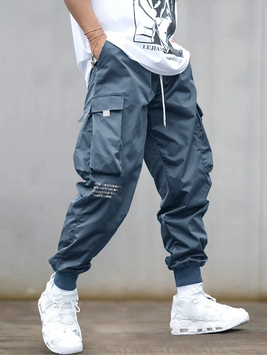 Claim Dot Men Loose Fit Slogan Graphic Flap Pocket Drawstring Waist Cargo Pants - Dusty Blue - View 1