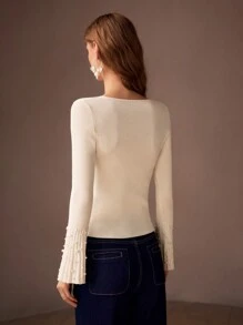 MOTF PREMIUM Jersey de punto estriado de ajuste ceñido con cuello en V, mangas de campana y detalles de perlas falsas