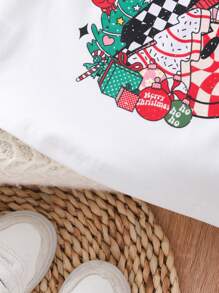 SHEIN Camiseta informal de manga larga y cuello redondo con estampado de Papá Noel de dibujos animados para niñas, otoño