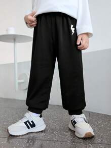 SHEIN Spodnie dresowe dla chłopców ze ściągaczem i elastycznym pasem, z nadrukiem, dla dzieci i młodzieży