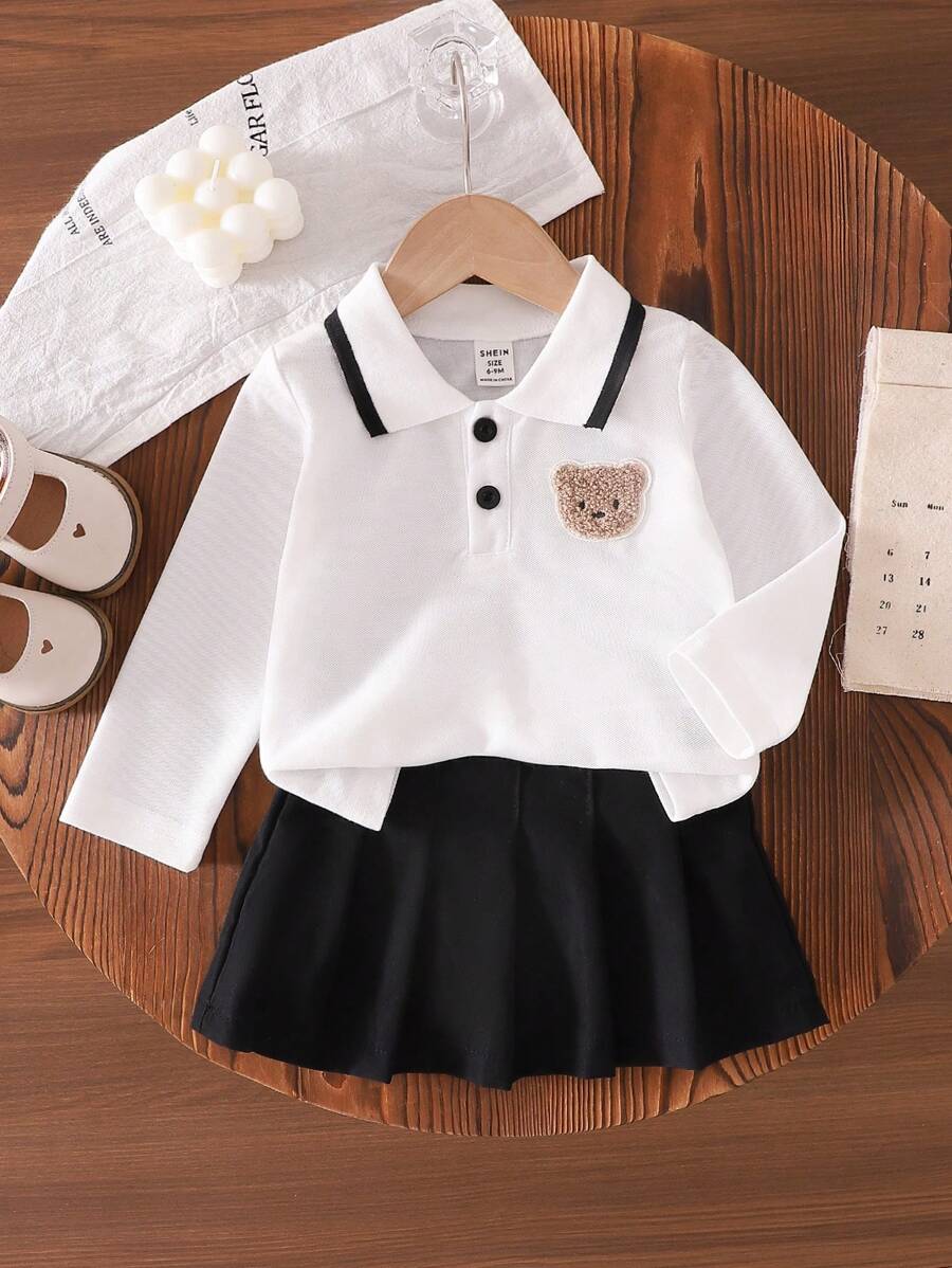SHEIN Baby Girls 2pcs Set: White Long Sleeve Bear Emblem Shirt + Solid Color Skirt - Black - View 1