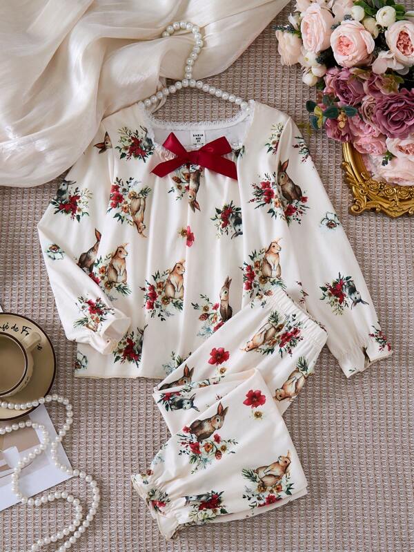 SHEIN Young Girl's Cute Cartoon Rabbit Printed Lace Edge Lantern Sleeve Top With Bowknot Ribbon And Long Pants Pajama Set