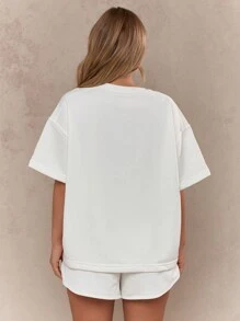 MISSGUIDED Conjunto de dos piezas con camiseta oversize y pantalones cortos con aplicaciones de rhinestones "WIFEY"