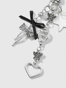 ROMWE Kawaii 1 件 Y2K 极简主义百搭极具吸引力的银色空心蝴蝶心形星形黑色丝带水钻蝴蝶 CCB 珠钥匙扣、包包饰物、耳机配件 - 适合女性、日常佩戴、礼物 - 銀色 - 查看 6