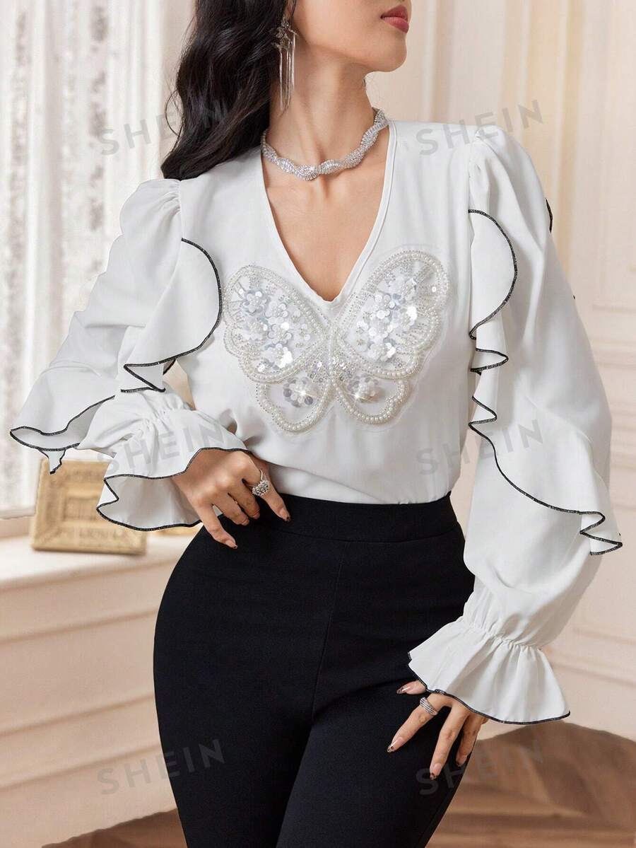 Modelyn Blusa elegante de mujer con volantes, decoración de perlas falsas y mariposa, para otoño
