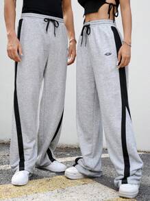 Manfinity Unisex Pantalones de chándal rectos y con cordón a media cintura de punto en patchwork, unisex