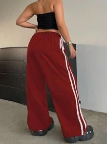 Flirla Pantalones con dobladillo para mujer de talla grande, con bordado en la costura lateral, cintura elástica con cordón ajustable y tobillos